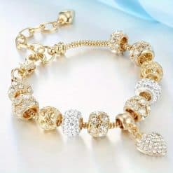 Charm bracelet with gold beads and heart charm