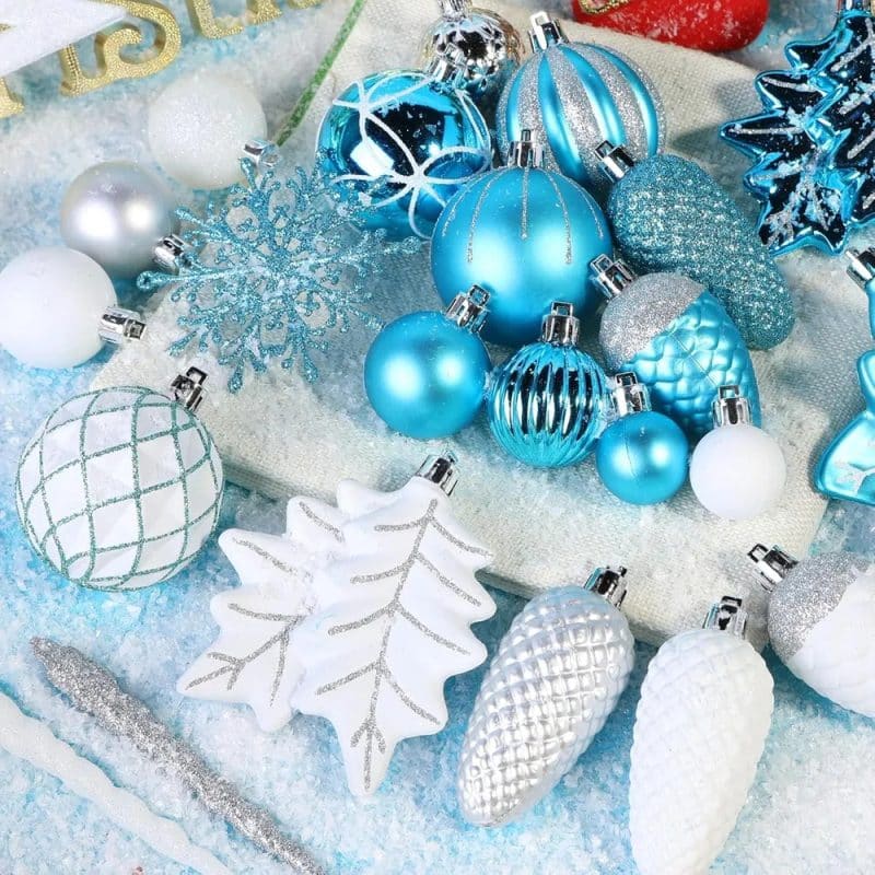 white christmas ornaments displayed on a decorated tree